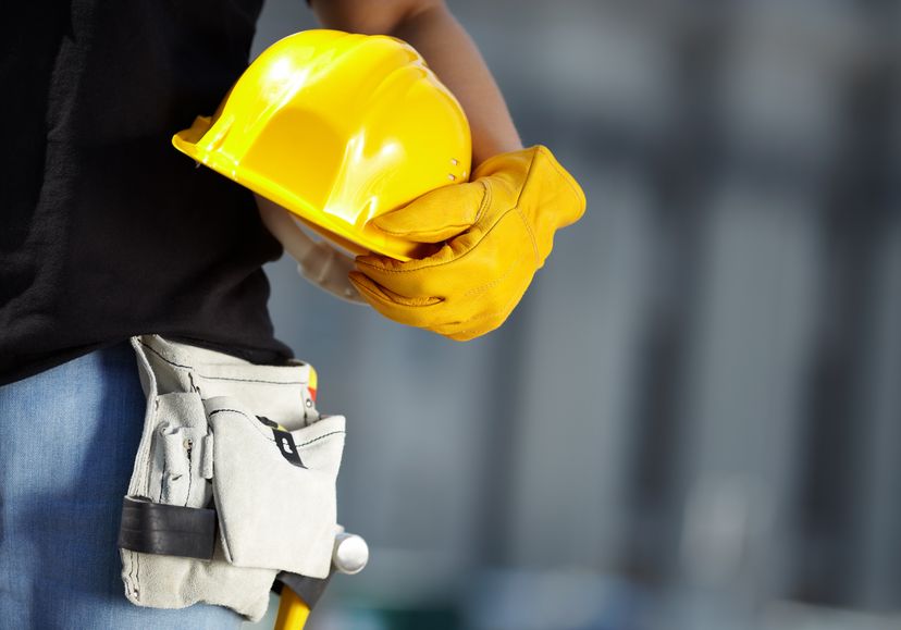 Offshore worker holding a safety helmet